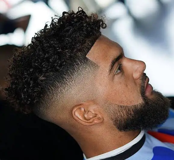 Mix of Short Curls and High Fade